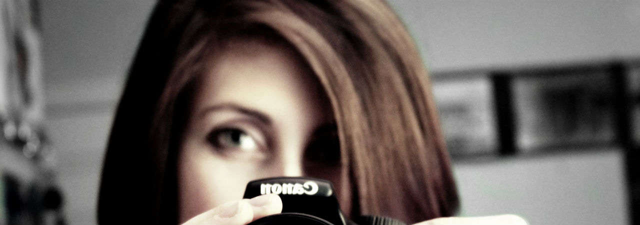 Image of woman using Digital SLR camera